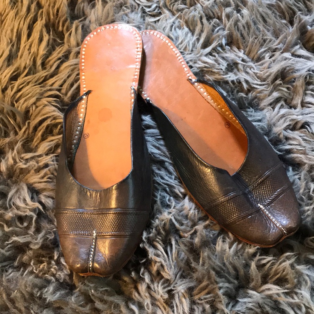 Handmade leather slip-on mules.